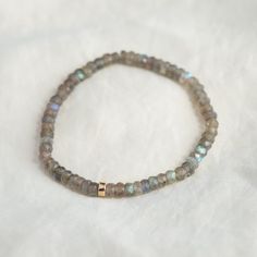 Want to save 15% off your first order? Sign up for our newsletter by visiting our website and filling out the pop up form. Receive a code by email, then send us that code through Etsy messages to save 15% off your ETSY order, sign up here: www.earthlyabundancejewelry.com  Super flashy beautiful labradorite, available two options: #1 Stretch bracelet - on elastic with a 14K gold filled accent  D E T A I L S △ Handmade in Canada △ Genuine Labradorite 4-4.5mm (roughly) △ 14K gold filled clasp and e Minimalist Rondelle Gemstone Beaded Bracelets, Everyday Moonstone Bracelets With Gemstone Beads, Everyday Moonstone Gemstone Beads Bracelets, Moonstone Beaded Bracelets With Natural Stones, Minimalist Natural Stone Beaded Bracelets For Everyday, Minimalist Hand-strung Rondelle Beaded Bracelets, Everyday Jewelry With Gemstone Beads And Labradorite, Minimalist Rondelle Gemstone Beads Bracelets, Dainty Rondelle Beaded Bracelets For Everyday