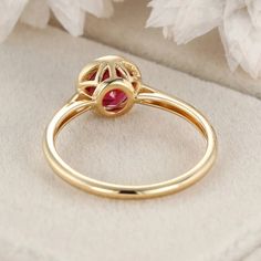 Art Deco 14K Solid Gold Vintage Round Cut Ruby Bezel Ring—a timeless and elegant choice that beautifully showcases the fiery allure of a round-cut ruby gemstone set in the vintage charm of 14k solid gold. Fine Jewelry Yellow Gold Ruby Ring With Halo Design, Yellow Gold Ruby Rings With Halo Design, Luxury Ruby Ring With Round Cut Birthstone, Ruby Birthstone Ring In Round Cut, Ruby Halo Ring For Promise Occasion, Yellow Gold Birthstone Ring With Round-cut Lab-created Ruby, Yellow Gold Ruby Halo Ring For Promise, Luxury Round Cut Ruby Birthstone Ring, Yellow Gold Birthstone Ring With Round Cut Lab-created Ruby