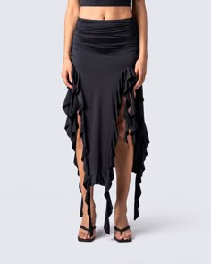 Owning an entire room has never been easier 😏 Rock your darker side with this sultry black jersey skirt. Complete with a high-waisted fit, shirring at the waist and hips, and front cutout detailing with a cascading ruffle hem 🖤 Elastane Bottoms For Club And Summer, High Waist Ruched Skirt For Party, Club-ready Fitted Mini Skirt With Ruffles, Black Hip-length Lined Skirt, Chic Black Hip-length Skirt, Edgy Fitted Skirt With Ruffles, Relaxed Elastane Maxi Skirt For Night Out, Relaxed Fit Elastane Maxi Skirt For Night Out, Black Hip-length Mini Skirt For Parties