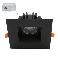 a black square recessed light with an orange trim