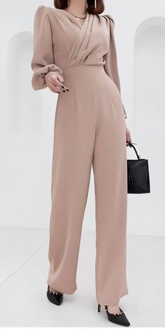 Elevate your wardrobe with this versatile beige jumpsuit. Perfect for both professional settings and evening events, this jumpsuit offers a flattering fit and timeless style. With free size exchanges and a free return policy, you can shop with confidence. Ideal for outfit ideas, fashion inspiration, and style tips, this jumpsuit is a must-have for every fashion-forward woman. Elegant Solid Color Pantsuit For Night Out, Elegant Solid Pantsuit For Night Out, Beige Pants For Spring Evening, Elegant Beige Pants For Party, Elegant Beige Party Pants, Chic Solid Color Jumpsuits And Rompers For Office, Chic Cream Pants For Evening, Chic Solid Color Jumpsuits For Office, Elegant Evening Jumpsuits And Rompers In Solid Color