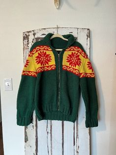 Vintage, handmade knit sweater. Unisex. No size tag - approx a women's L or men's M - please see measurements below!! The sweater is done in a Rasta color pallet of green, red and yellow, The sweater is primarily green with a chunky fair isle stripe that spreads across the chest, sleeves, and back. The sweater zips up; zipper in good working condition. The sweater could be worn zipped up or open like a cardigan. It has a collar that folds over. Sleeves could be rolled up once or left unrolled. I Rasta Colors, Fall Winter Fashion, Handmade Knit, Red Green Yellow, Handmade Knitting, Fair Isle, Size Tag, Spreads, Green Yellow