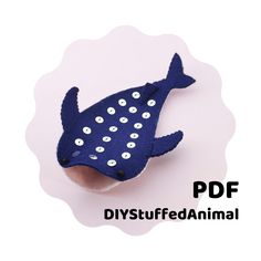 a blue fish brooch sitting on top of a white background with the words diy stuff