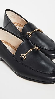 Elegant Leather-lined Slip-ons For Fall, Elegant Leather Footbed Slip-ons For Office, Classic Slip-on Loafers With Metal Feet, Business Slip-on Loafers With Metal Feet, Formal Closed Toe Flats With Leather Footbed, Formal Leather Shoes With Metal Feet And Flat Heel, Flat Heel Loafers With Leather Footbed For Galas, Elegant Flat Slip-ons For Work, Elegant Flat Oxfords For Business