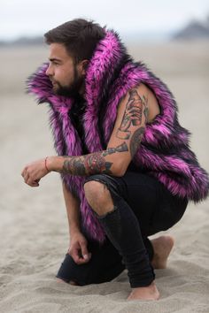 Pink Panther Festival Vest Envelop yourself in the playful allure of the 'Pink Panther' festival vest, a snuggly companion for festival frolics under the moonlit sky. Whether you're prowling the Playa or lost in a forest rave, this vest's vibrant faux fur is your bold statement piece, bursting with the primal energy of its namesake feline. Choose from three enchanting linings: 'God's Venus' mimics the intricate tapestries of ancient deities, 'Disco Ball' reflects your inner party spirit with a g Festival Vest, Lightning In A Bottle, Moonlit Sky, Pink Panther, Cold Nights, Pink Panthers, Faux Fur Vests, Fur Vest, Disco Ball