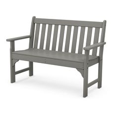 a gray bench sitting on top of a white floor