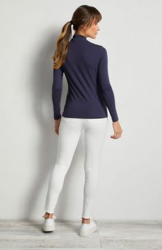 This stylish women's travel shirt is crafted with silky, stretch jersey fabric, perfect for anywhere you want to go. Slim fit 1/4 zip turtleneck Long sleeve Silky mid-weight stretch jersey Length hits just at the hip Casual Long Sleeve Mock Neck Top, Versatile Stretch Half-zip Tops, Versatile Fitted Half-zip Top, Fitted Half-zip Tops For Layering, Casual Stretch Elastane Turtleneck, Versatile Stretch Mock Neck Top In Elastane, Modern Athleisure, Travel Vest, Curvy Pants