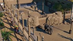 an aerial view of some elephants in their pen