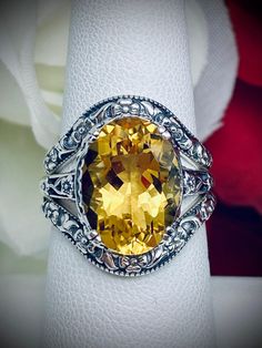 Natural Yellow Citrine Ring and Curved Band Set Option Edward Design#70 Made To Order This filigree ring is an Edwardian antique reproduction in sterling silver set with a 4+ carat natural honey-yellow citrine gemstone solitaire. This faceted cut oval gem is 14mm x 10mm. This ring sits 7mm off the finger. The inside of the band is marked 925 for sterling silver. This ring now has a matching floral accompanying curved band. This band was specially designed to fit this ring perfect. You can elect Luxury Yellow Gemstones For Wedding, Luxury Citrine Gemstones For Wedding, Classic Oval Gemstones For Wedding, Luxury Yellow Gemstones For Anniversary, Elegant Yellow Gemstones For Wedding, Exquisite Topaz Ring With Prong Setting, Luxury Citrine Rings For Anniversary, Elegant Yellow Topaz Ring With Gemstone Accents, Yellow Gemstones For Wedding, Fine Jewelry