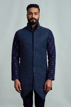 Navy blue bundi with embroidered motifs. Comes with kurta and pant.
Component: 3
Embroidery
Neckine: Kurta: Band collar; Bundi: Band collar
Sleeve Length: Kurta: Full; Bundi: Sleeveless
Fabric: Suiting
Color: Blue - Aza Fashions Blue Embroidered Long Sleeve Sherwani, Royal Blue Traditional Long Sleeve Wear, Royal Blue Long Sleeve Traditional Wear, Designer Blue Nehru Jacket With Traditional Drape, Designer Blue Nehru Jacket For Diwali, Blue Bollywood Nehru Jacket With Intricate Embroidery, Blue Embroidered Nehru Jacket With Traditional Drape, Designer Embroidered Blue Bandhgala, Designer Blue Embroidered Bandhgala