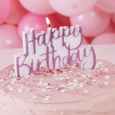 a birthday cake with pink and white frosting that says happy birthday