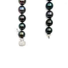 This beautiful black Tahitian pearl necklace ranges from 12 mm to 16.30 mm. The clasp has 114 round brilliant diamonds weighing 2.25 ct. The diamonds boast a color of E/F, are VS1 in clarity and are set in 18k white gold. A perfect piece for everyday wear! Luxury Tahitian Pearl Jewelry With Diamond Accents, Luxury Black Pearl Necklace With Round Beads, Luxury Black Tahitian Pearl Necklaces, Formal Black Tahitian Pearl Necklace, Luxury Black Single Strand Pearl Necklace, Formal Black Tahitian Pearl Necklaces, Black Tahitian Pearl Jewelry With Round Beads, Black Tahitian Pearl Round Beads Jewelry, Formal Black Tahitian Pearl Jewelry