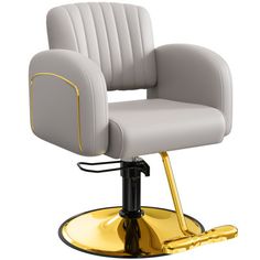 a gray and yellow chair with gold trimmings sitting on a metal base in front of a white background