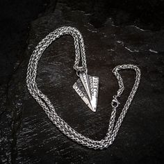 This striking Odin's Spear Necklace is perfect for those who want to make a statement. Made of solid stainless steel, this pendant is in the shape of Gungnir, Odin's spear. The runic decoration adds a touch of mystery, while the sleek, minimalist design makes it versatile enough to wear with any outfit. Supplied with matching 24" / 60cm chain Viking Style Oxidized Metal Necklace, Viking Style Oxidized Metal Necklaces, Viking Pendant Necklace With Oxidized Finish, Viking Oxidized Pendant Necklace, Viking Style Sterling Silver Nickel-free Necklace, Viking Style Engraved Metal Necklaces, Nickel-free Viking Style Sterling Silver Necklace, Nickel-free Sterling Silver Viking Necklace, Viking Style Nickel Free Pendant Necklace