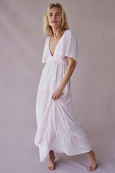 Forever free and flowy, this effortless maxi dress from our free-est collection is featured in a V-neck, tiered silhouette with flutter sleeves for added shape. * Soft, textured fabrication * Elastic empire waist * Effortless, pull-on style | La La Maxi Dress by free-est at Free People in Pink, Size: L Airy Flowy V-neck Dress, Breezy V-neck Maxi Dress With Ruffles, Flowy Tiered Breezy Maxi Dress, Flowy V-neck Tiered Dress For Beach, Flowy V-neck Tiered Beach Dress, Flowy Bohemian V-neck Tiered Dress, Flowy Bohemian Tiered V-neck Dress, Summer Billowy V-neck Maxi Dress, Feminine Flowy V-neck Tiered Dress