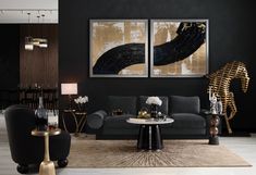 a living room filled with black furniture and gold accents