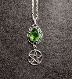 Pentacle Peridot Necklace  SIZE 4.5x1.7cm / 1.5x0.5 inches  18 inch silver plated chain included Peridot Happiness, abundance and light.  Protection against difficulties and negativity. We try and describe and take all photos to truly show what the item is like in real life, but due to different devices, screens, cameras and brightness levels there may be some slight variations. Measurements are approximate. Witchy Sterling Silver Necklace For Gift, Sterling Silver Witchy Necklace For Gift, Gothic Dangle Necklaces As Gifts, Gothic Dangle Necklaces For Gifts, Gothic Dangle Necklace For Gift, Gothic Green Jewelry For Gifts, Green Gothic Jewelry For Gifts, Green Gothic Style Jewelry Gift, Green Gothic Jewelry Gift