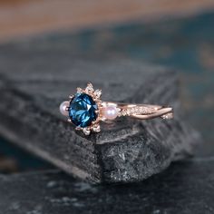 Rose Gold And Pearl Blue Topaz Engagement Ring Infinity Wedding Band Akoya Pearl Birthstone June Bridal Ring Diamond Women Anniversary Gift Same Design with difference gemstone: https://www.etsy.com/listing/612889885 https://www.etsy.com/listing/606125915 https://www.etsy.com/listing/599049598 ITEM INFORMATION: Metal Type- Solid 14K Rose Gold Ring Size Available- US3# -10# *Engagement Ring Details： WIDTH-( approx. 2.3mm ) 1.Center Stone- 6mm Natural Blue Topaz, Round Cut 2.Side Stones - Natural Blue Topaz And Pearl Ring, Elegant Topaz Ring With Prong Setting For Wedding, Elegant Topaz Wedding Ring With Prong Setting, Elegant Wedding Topaz Ring With Prong Setting, Elegant Blue Bridal Sets Gift, Rose Gold Topaz Ring With Diamond Accents For Wedding, Rose Gold Sapphire Ring With Center Stone For Wedding, Wedding Topaz Ring Fine Jewelry, Wedding Topaz Ring With Center Stone