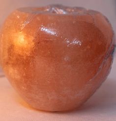 an apple shaped object sitting on top of a table