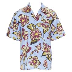 PRADA 2019 Hibiscus floral print short sleeve Hawaiian bowling camp shirt M Reference: TGAS/A05859 Brand: Prada Designer: Miuccia Prada Collection: Spring Summer 2019 Material: Cotton Color: Blue Pattern: Floral Closure: Button Extra Details: Light blue cotton with pink and green Hibiscus floral print. Signature Prada Hawaiian Bowling shirt. Camp collar. Logo tab at breast pocket. Made in: Italy CONDITION: Condition: Unworn in mint condition, with tags. Comes with: Designer tags. SIZING Designer Blue Prada, Hibiscus Pattern, Mint Green Tops, Hibiscus Print, Prada Collection, Floral Hawaiian Shirt, Bowling Shirt, Style Inspiration Summer, Camp Shirt