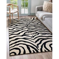 a black and white zebra print rug in a living room