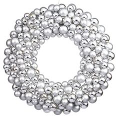 a silver beaded wreath with white balls on the front and center, set against a white background