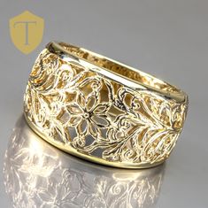 This modern 14K gold nugget ring is a bold statement piece with its distinctive textured design. Weighing 5.5g and sized at 7, the ring offers finger coverage of 12.4mm with a low rise of 3.2mm, giving it a substantial yet sleek profile. Marked "14k" and in great condition, this nugget ring embodies rugged elegance, making it an eye-catching addition to any collection. Karat: 14K Weight: 5.5 g Size: 7 Approximate measurement: Coverage: 12.4 / Rise: 3.2 Marking: 14k  Condition: Great Approx. Era: Modern DELIVERY Our shipping and handling is always fast & free unless otherwise stated. Once an order is placed and payment is received, all items are shipped within one business day, excluding weekends.   For international shipments, we use Etsy's International Shipping Program. RETURNS We are fl Gold Nugget Ring, Gold Nugget, Ladies Ring, Textured Design, Ring Size 7, Rings Statement, Women Rings, Statement Rings, Low Rise