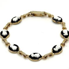 Vintage 1960's Gold Toned Black & White Cameo Chain Bracelet CLAS Costume Jewelry!   Very sweet cameo bracelet. Perfect for a gift for a teenage young girl.  Measurements: 6.5" long x .25" width Please take a moment to look at the other cool and eclectic vintage items I have here in my Etsy shop. Follow Chez Gigi Studios for new daily listings! Thanks! Celeste @ Chez Gigi Studios  https://linktr.ee/chezgigistudios Cameo Bracelet, 1960s Jewelry, Vintage Eclectic, Chain Link Bracelet, Chain Bracelet, Chain Link, Costume Jewelry, Vintage Shops, Jewelry Bracelets