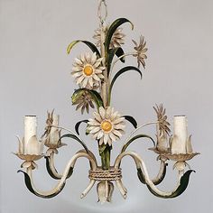 a white chandelier with flowers on it