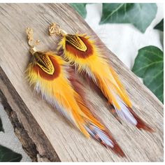 Silver or gold funky & quirky bohemian long feather earrings with stripy brown, white & sunshine yellow feathers Carefully handmade from unique real feathers. Beautiful big colorful statement accessories for summer music festivals, BBQs, parties or outdoor weddings! They are very soft and flexible.   Feathers: 10-12cm (4-5") These fun boho hippie dangle earrings are lightweight and comfortable to wear, and are made with silver or gold plated earring hooks, huggie leverback hoops or clip-ons.  Se Bohemian Single Earring For Summer, Multicolor Feather Jewelry For Festivals, Yellow Bohemian Drop Earrings, Yellow Jewelry For Summer Gifts, Yellow Summer Jewelry Gift, Gold Feather Earrings As A Gift, Gold Feather Earrings For Gift, Handmade Yellow Artsy Earrings, Handmade Artsy Yellow Earrings