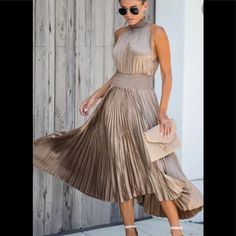 Bronze Colored Smocked Waist Chic Pleated Stretch Maxi Dress, Chic Stretch Pleated Maxi Dress, Flowy Party Midi Dress With Smocked Back, Flowy Midi Dress With Smocked Back For Party, Non-stretch Pleated Maxi Dress For Summer, Chic Beach Dress With Pleated Waist, Fall Evening Dresses With Smocked Back, Casual Stretch Pleated Midi Dress, Casual Stretch Midi Dress With Pleats