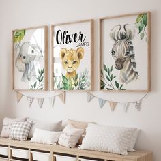 three framed pictures hang on the wall above a wooden bench with pillows and pillow cases