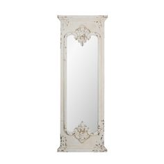 an ornate white mirror on a white wall