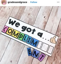 we got a complimim event sign and cut out letters on a wooden floor