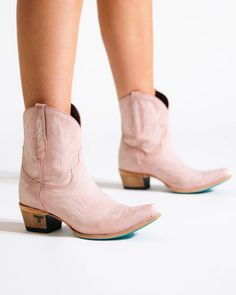 Heirloom quality pink ankle boots with a core western influence. The classic snip toe profile is embroidered to perfection with a twist on traditional flame stitch in bootie form. Blush Pink Cowgirl Boots Heel Height: 1.75" Shaft Height: 8" Ankle Circumference: 12" Toe Shape: Snip Distressed Stonewash Finish Signature Turquoise Soles Wedding Cowboy Boots, Pink Ankle Boots, Pink Cowboy Boots, Pink Cowgirl Boots, Lane Boots, Pink Cowboy, Boots Heel, Western Store, Pink Cowgirl