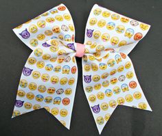 a white bow with emoticions on it