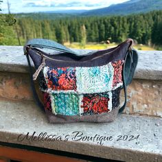 Introducing The Adeline, a handmade, one-of-a-kind convertible-style boho handbag that radiates charm and individuality. This exquisite bag features raggy style quilted patches on the front with upcycled denim for the backside with a zippered pocket and a slip pocket for convenience! Distressed grey cowhide leather accents, beautifully showcasing shades of blue & coral. The Adeline includes strapping that effortlessly converts from shoulder carry to backpack carry in seconds! Designed for comfortable and versatile wear. The leather bottom adds durability, while the gorgeous blue batik cotton interior fabric, enhances its bohemian flair. Inside, you'll find three slip pockets and one zippered pocket, providing ample space for your essentials. Measuring 14" x 11" x 5.5", this handbag offers Patchwork Hobo Bag For Everyday Use, Bohemian Canvas Hobo Bag For Travel, Bohemian Canvas Shoulder Bag For Daily Use, Bohemian Style Canvas Shoulder Bag For Daily Use, Canvas Patchwork Shoulder Bag For Everyday, Everyday Canvas Patchwork Shoulder Bag, Bohemian Canvas Rectangular Bag, Bohemian Canvas Hobo Bag, Blue Bohemian Hobo Bag For Everyday Use