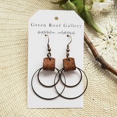 These bronze and leather hoop earrings are simply beautiful. The double hoop design is finished with a hand-patterned medium brown leather strip. They are lightweight and very easy to wear. -Vegetable tanned leather -Eco-friendly leather dye -Nickel free antique bronze brass hardware. -Rubber back (be sure to wear backs with these earrings) **Do not wear in water.** This listing is for one pair of bronze metal and leather hoop earrings. Brown Hoop Earrings Gift, Handmade Brown Hoop Earrings For Everyday Wear, Modern Small Hoop Brown Earrings, Everyday Handmade Brown Hoop Earrings, Minimalist Brown Hoop Earrings For Gift, Modern Brown Small Hoop Earrings, Brown Hoop Earrings With Ear Wire For Gift, Everyday Brown Metal Earrings, Minimalist Brown Hoop Earrings For Everyday