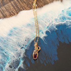 Pendant size: 1 inch x .5 cm Lab created quality teardrop ruby gemstone. 14k gold filled wire wrapped and 14k gold filled chain with handmade gold toggle clasp. 0 inches means no chain.   Ruby spiritual meanings: ~ Loving 🥰 ~ Nurturing 🪴 ~ Health ☘️ ~ Wealth 💰 Ring Bracelet Chain, Gold Wrap, Ruby Necklace, Red Gemstones, Ruby Gemstone, Handmade Gold, Wrapped Pendant, Gothic Jewelry, Gold Filled Chain