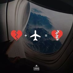 an airplane window with two hearts and a plane