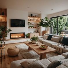 a living room filled with furniture and a fire place in the middle of it's wall