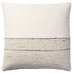 a white and grey pillow with two horizontal lines on the front, one line down the middle