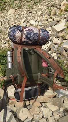 a backpack sitting on top of a pile of rocks