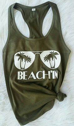 Beachin Womens Tank / Summer Shirt / Tropical Tank / Shirt for the Beach / Beach Shirt / Vacation Shirt / Cruise shirt / Bachelorette Shirt Description - Muscle Tank * 3.7 oz., 65% poly/35% viscose (unless otherwise noted) * 30 single * Relaxed, drapey fit * Low cut armhole * Curved bottom hem * Side-seamed Athletic Heather: * 52% poly/48% viscose Green Cotton Shirt For Beach Season, Green Summer Shirt For Vacation, Green Graphic Print Shirt For Vacation, Green Graphic Print Vacation Shirt, Green Summer Vacation Shirt, Vacation Green Shirt With Graphic Print, Vacation Green Graphic Print Shirt, Summer Vacation Green Shirt, Green Summer Beach Shirt