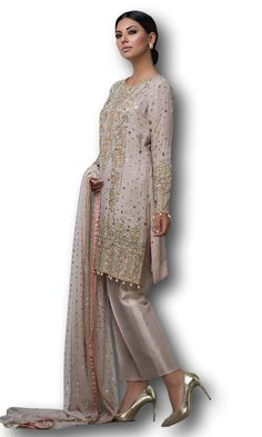 This salwar kameez is featured in georgette fabric. Shirt of this salwar kameez is embellished with zardozi work. Dupatta is in net fabric with all over sequin work and four-sided border. Trouser is in satin silk. Indian Fashion Salwar, Latest Anarkali Suits, Salwar Kameez Online Shopping, Floor Length Anarkali, Long Anarkali, Designer Anarkali Suits, Zardozi Work, Gotta Work, Gotta Patti