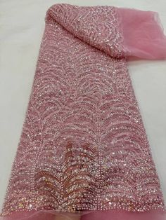 This high quality Fabric is measured in 5 Yards With Embroidered Beading and Sequin. It is soft, very delicate and beautiful. This high Quality Fabric is made with Fashion embroidered rhinestones can be used in making party wedding dresses, skirts, shawls, scarves and other other fashion apparels as you would like. Size : Length : 5 yards (180 inch). Width: 50 inch (Please allow slight deviation for the measurement data ,±1 inch) Material: 100% Polyester, Tulle Lace Fabric, Eco-Friendly embroide Pink Sequin Fabric With Pearl Embroidery For Party, Elegant Pink Fabric For Party, Pink Beaded Embroidered Fabric For Party, Elegant Pink Embroidered Sequin Fabric, Elegant Pink Embellished Sequin Fabric, Pink Beaded Lace Embroidered Fabric, Pink Embroidered Fabric With Rhinestones For Wedding, Pink Lace Fabric With Rhinestones Embroidery, Pink Rhinestone-embroidered Lace Fabric