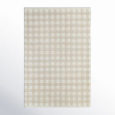 a beige and white checkered area rug