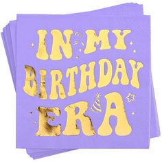 purple paper napkins with gold foil lettering that says in my birthday era