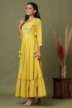 Cotton Yellow Anarkali Style Embroidered Gown | Best Indian Ethnic wear Online USA | Festive Straight Kurta Sharara With Tassels, Festive Sharara With Tassels And Straight Kurta, Traditional Anarkali Set With Tassels For Designer Wear, Festive Bollywood Kurta With Tassels, Designer Anarkali Set With Tassels For Diwali, Festive Kurta With Tassels, Festival Kurta With Tassels, Designer Salwar Kameez With Tassels For Eid, Diwali Anarkali Set With Straight Kurta And Tassels