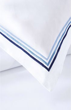 three sheets with blue and white stripes on them